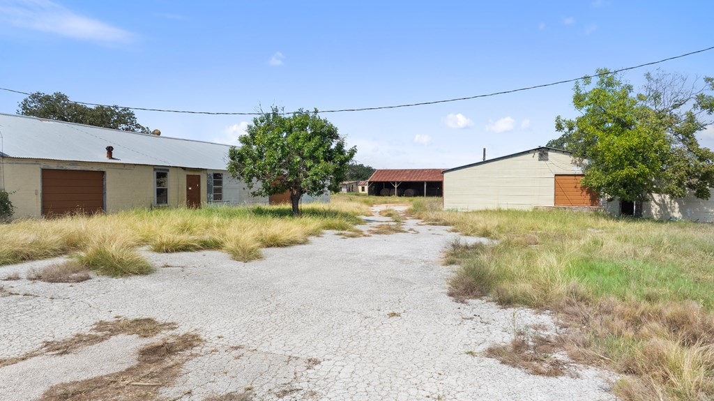131 Elberta Street Stonewall, TX 78671 - Photo 25 of 71 a view of a house with a yard