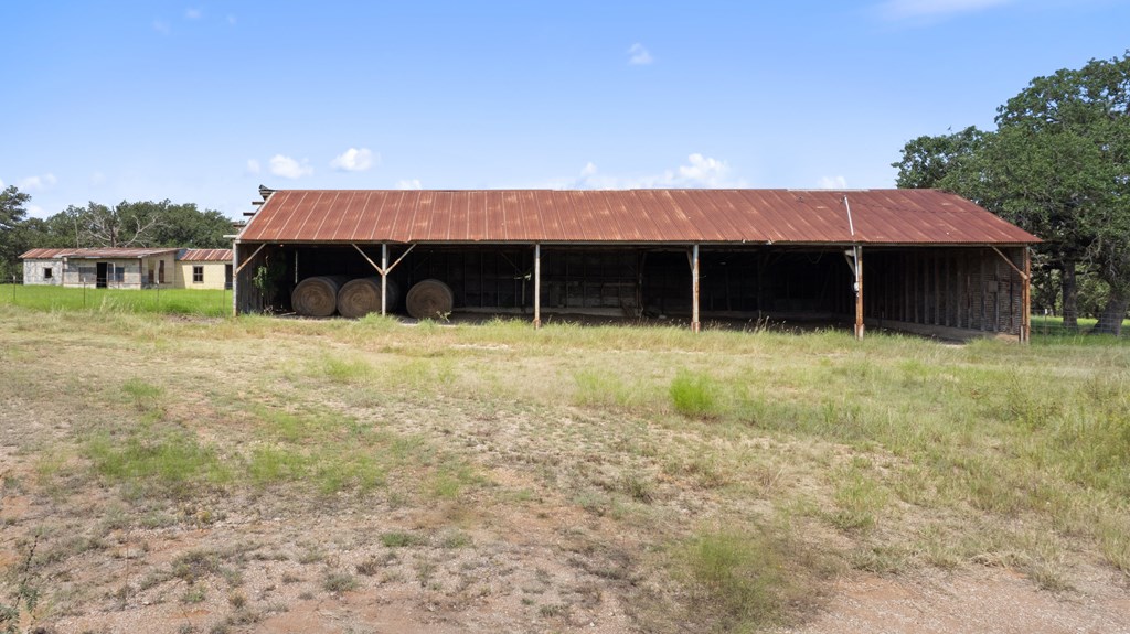 131 Elberta Street Stonewall, TX 78671 - Photo 27 of 71 a view of a house with backyard