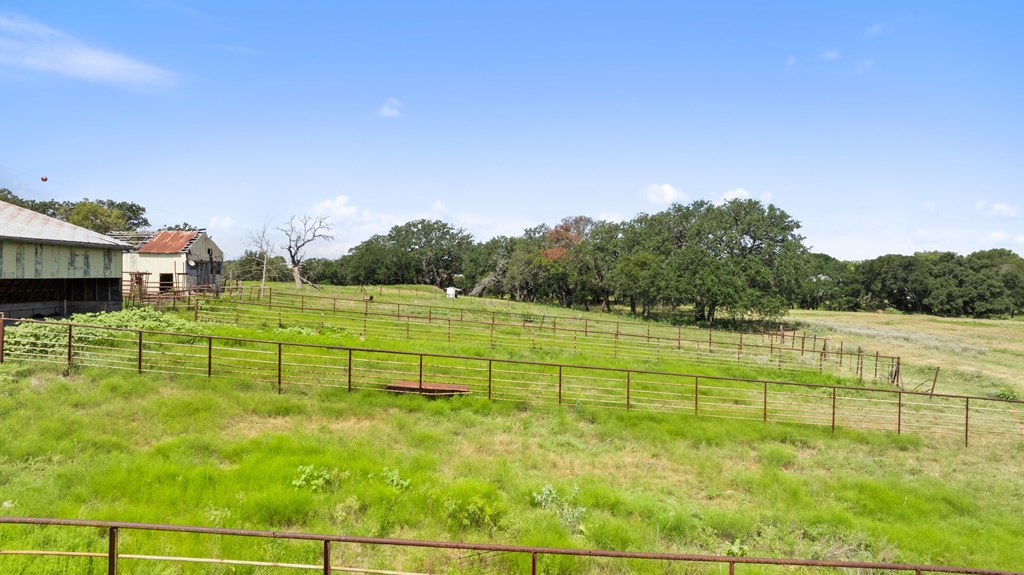 131 Elberta Street Stonewall, TX 78671 - Photo 30 of 71 a view of a golf course with a lake view