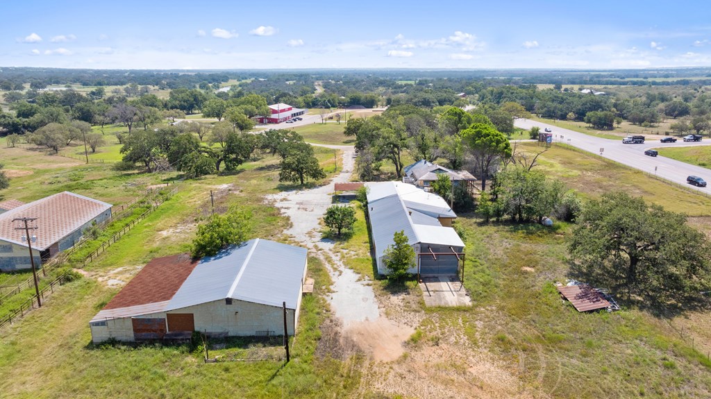 131 Elberta Street Stonewall, TX 78671 - Photo 7 of 71 an aerial view of a house with a yard swimming pool and outdoor seating