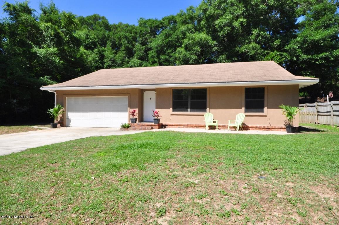 450 Orchis Road St. Augustine, FL 32086 - Photo 1 of 18 a view of a house with backyard and chairs
