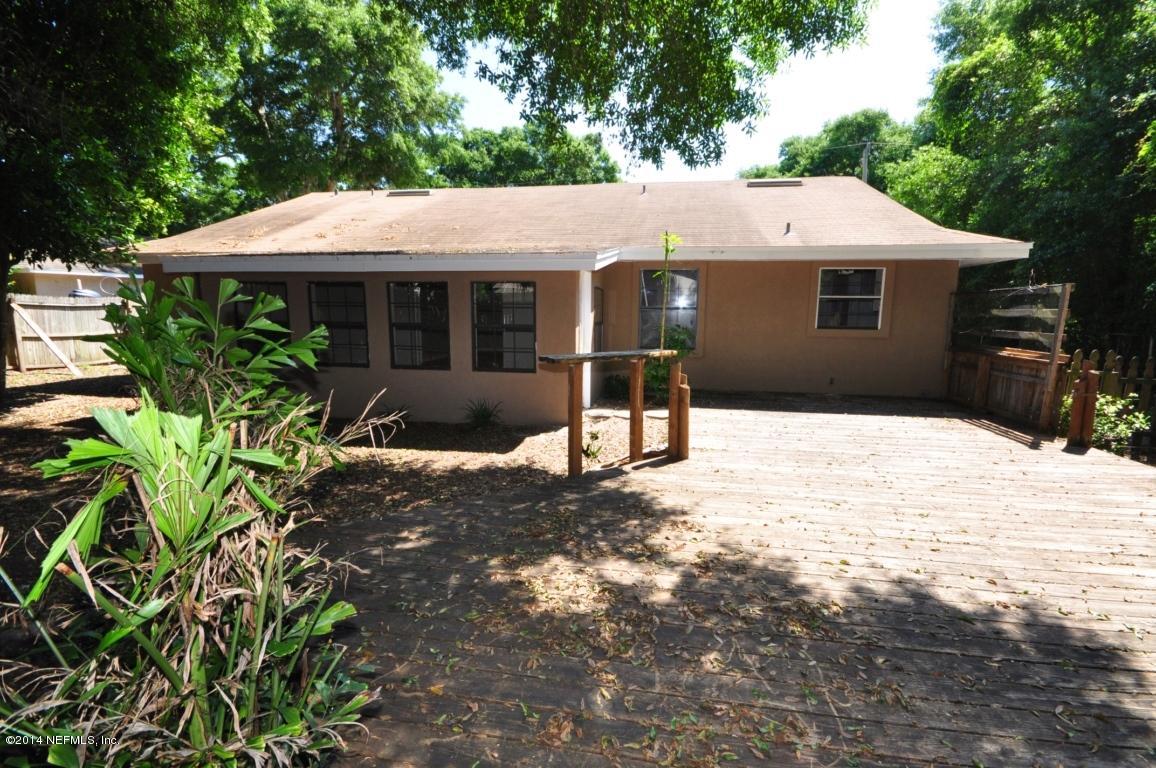 450 Orchis Road St. Augustine, FL 32086 - Photo 15 of 18 a front view of a house with a yard and garage