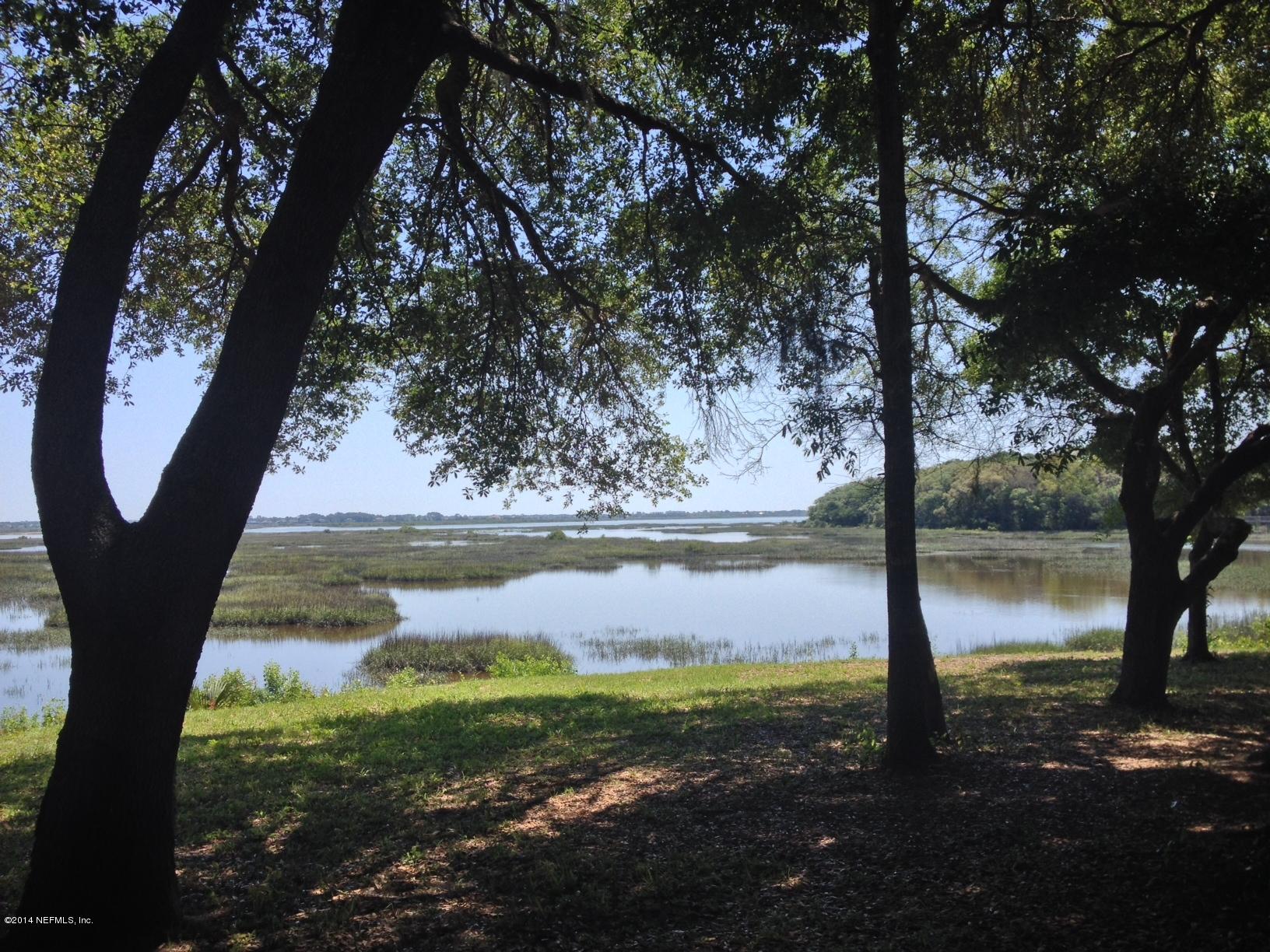 450 Orchis Road St. Augustine, FL 32086 - Photo 18 of 18 a view of a lake with a yard