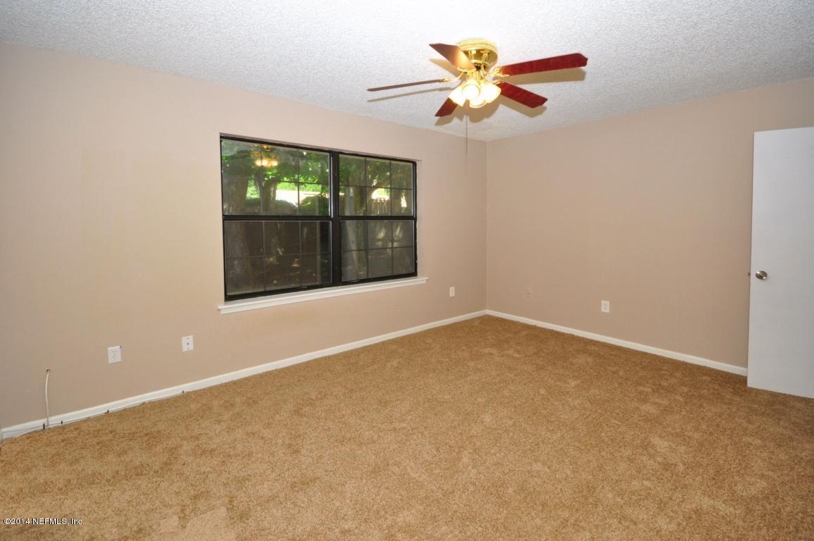 450 Orchis Road St. Augustine, FL 32086 - Photo 8 of 18 an empty room with a fan