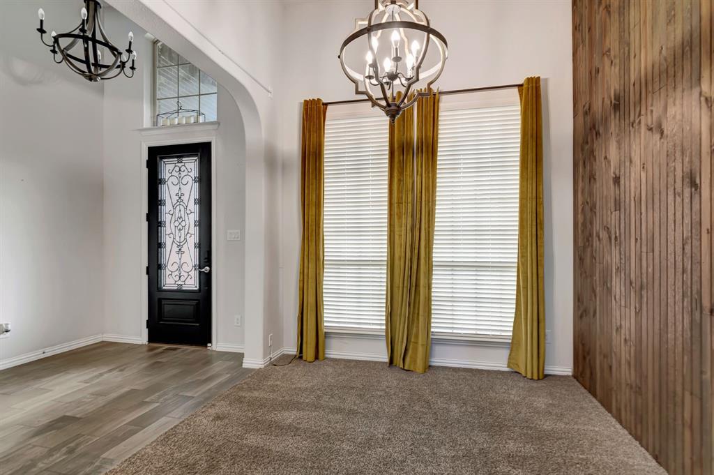 3061 Bella Lago Drive Fort Worth, TX 76177 - Photo 6 of 27 a view of empty room with wooden floor and fan