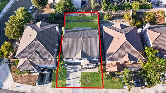 an aerial view of houses with outdoor space