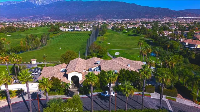 an aerial view of a residential houses with outdoor space and street view