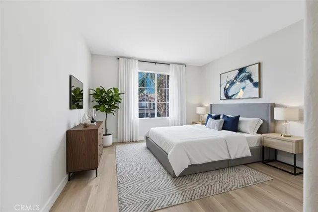 a bedroom with a large bed and a couch