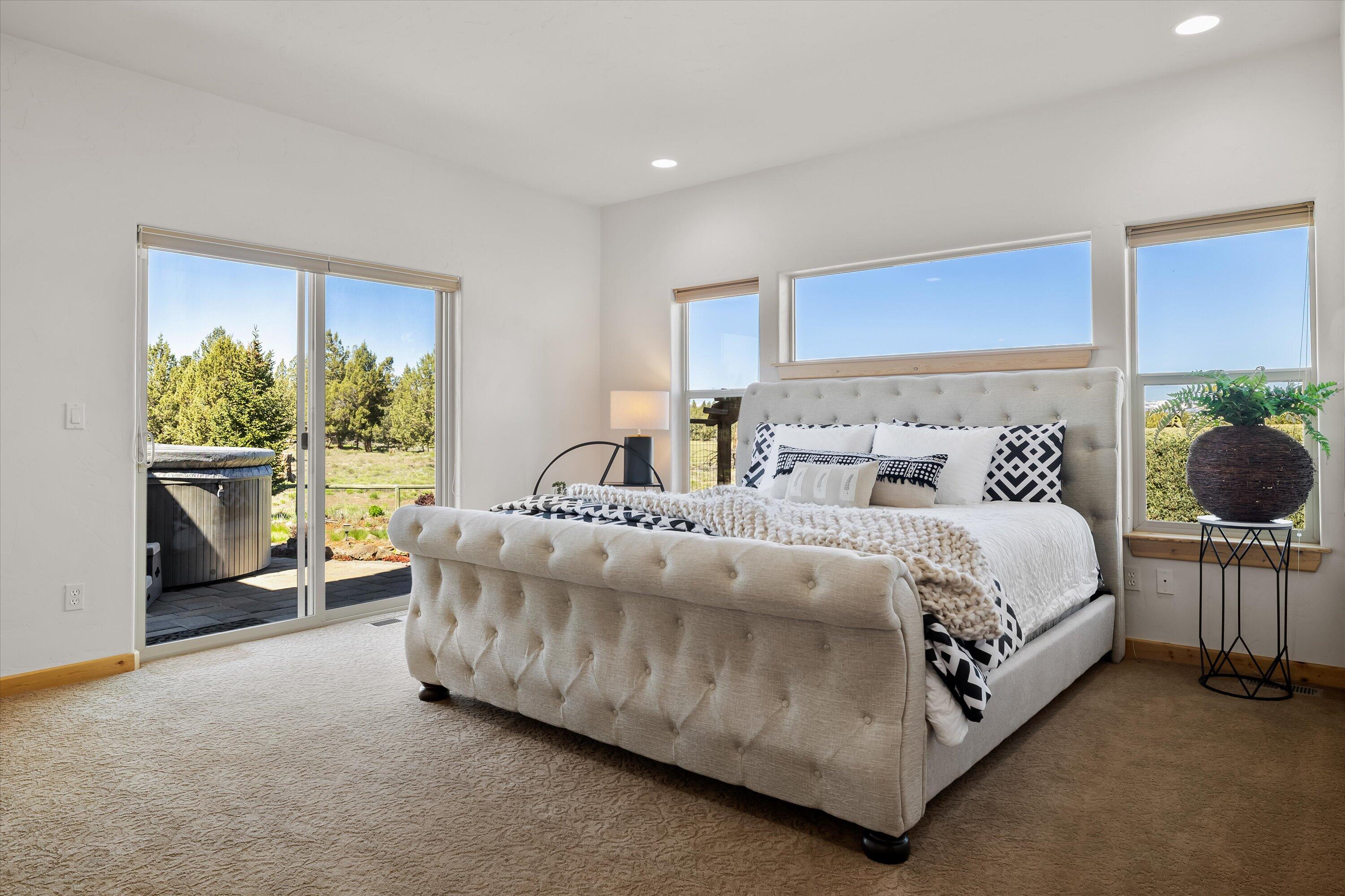 69125 Hurtley Ranch Road Sisters, OR 97759 - Photo 22 of 77 Take respite in the luxurious main level mountain view primary suite w/propane fireplace, spa style ensuite & access to hot-tub patio.