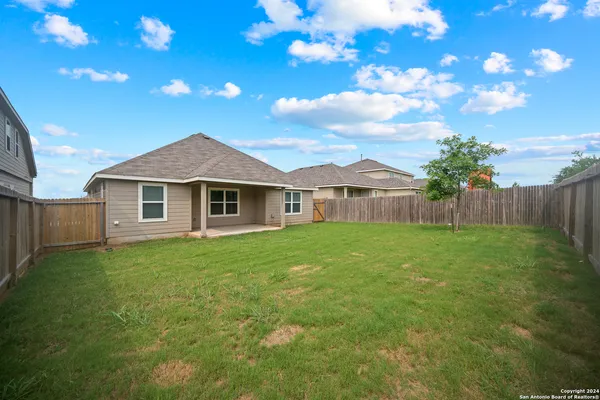 a view of a yard in front of a house with a yard