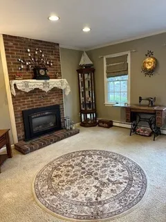 an entryway with fireplace and window