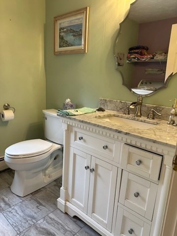 54 Frazier Way Barnstable, MA 02648 - Photo 21 of 31 a bathroom with a granite countertop toilet sink and mirror