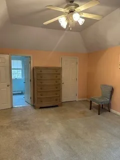 a view of an empty room with a cabinet