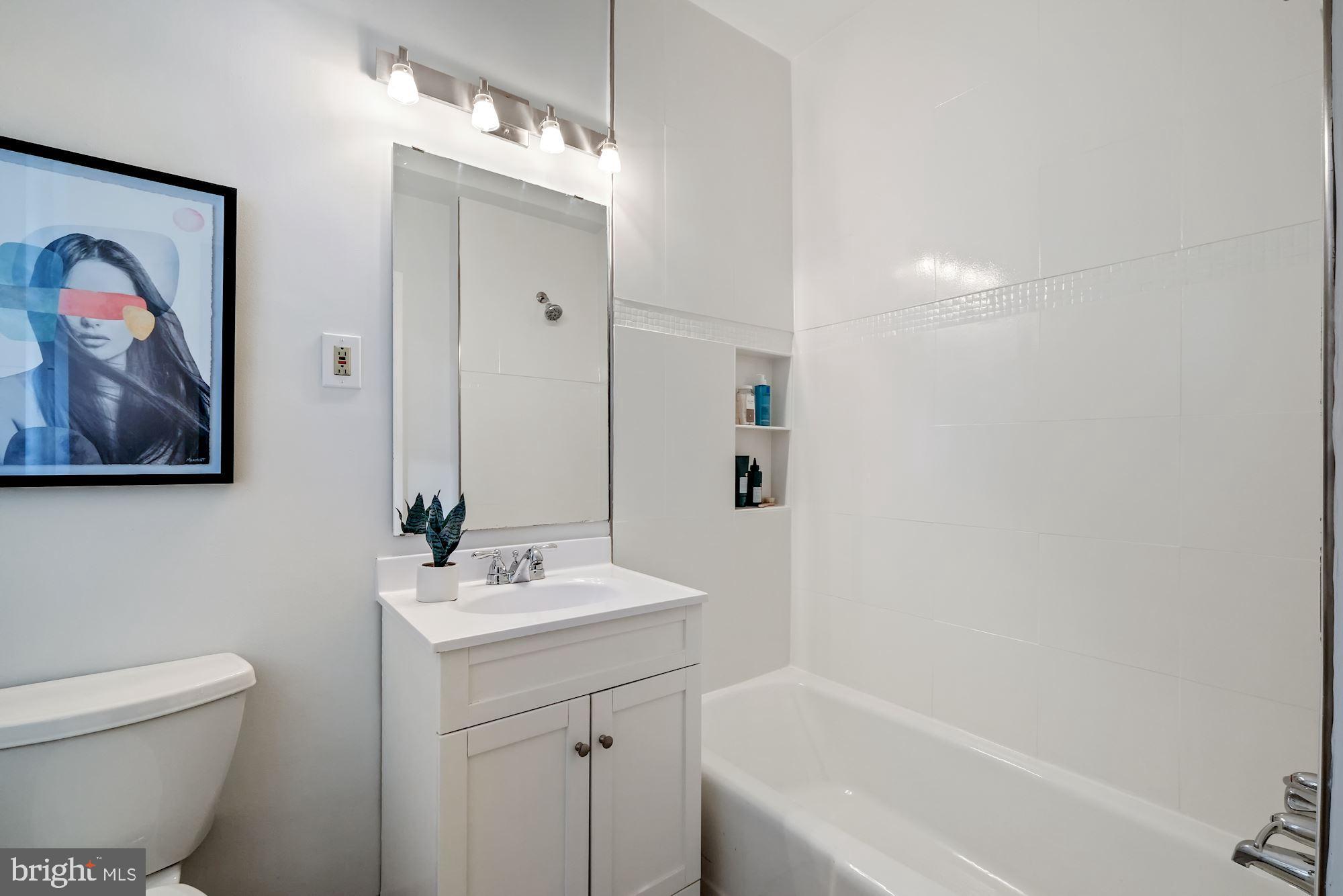 1901 Columbia Road Northwest, Unit 603 Washington, DC 20009 - Photo 13 of 21 Updated Bathroom (Linen Closet Not Pictured)