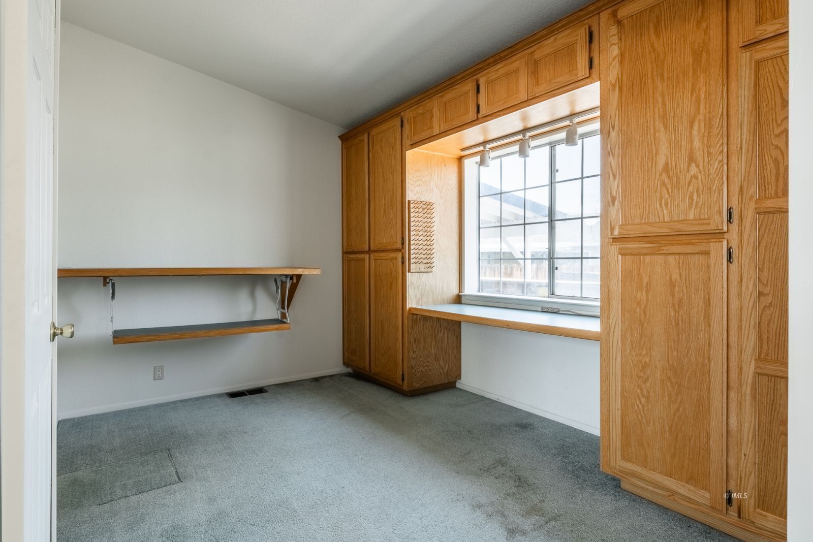 77 Olivia Lane Big Pine, CA 93513 - Photo 14 of 35 a view of an empty room with a window