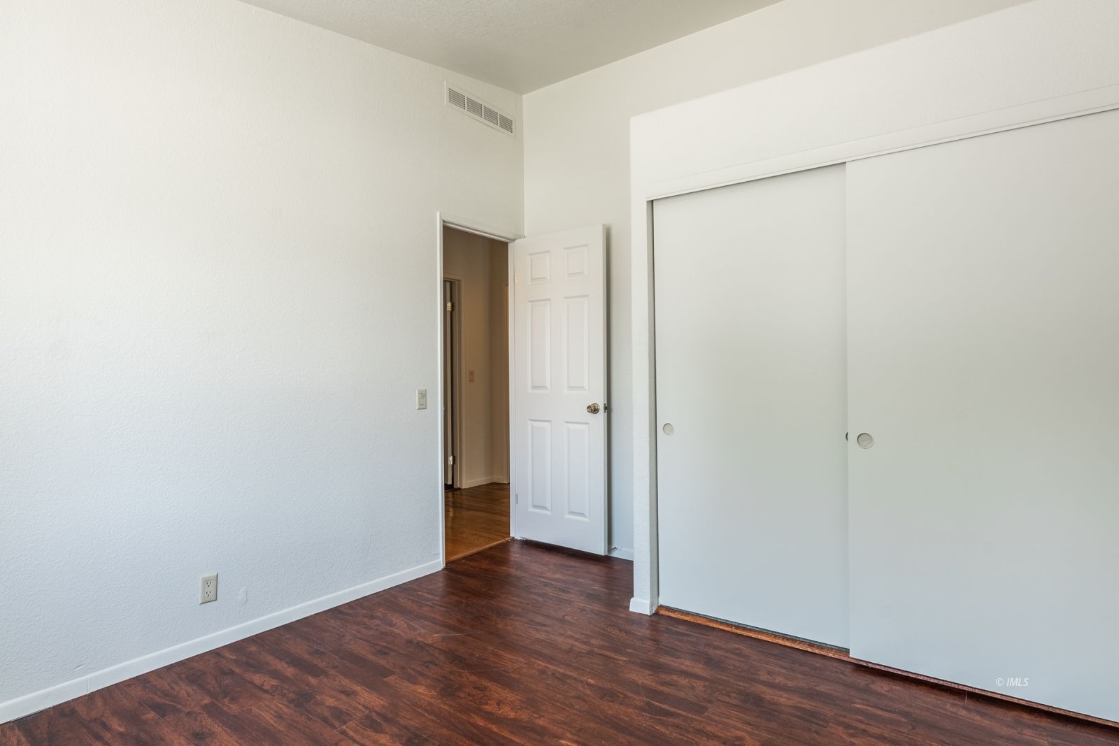 77 Olivia Lane Big Pine, CA 93513 - Photo 19 of 35 a view of an empty room with wooden floor