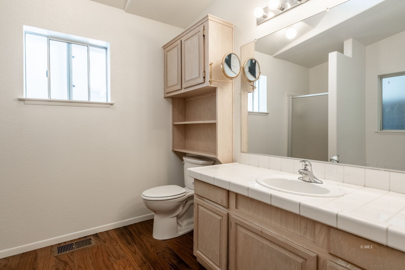 77 Olivia Lane Big Pine, CA 93513 - Photo 23 of 35 a bathroom with a sink toilet and window