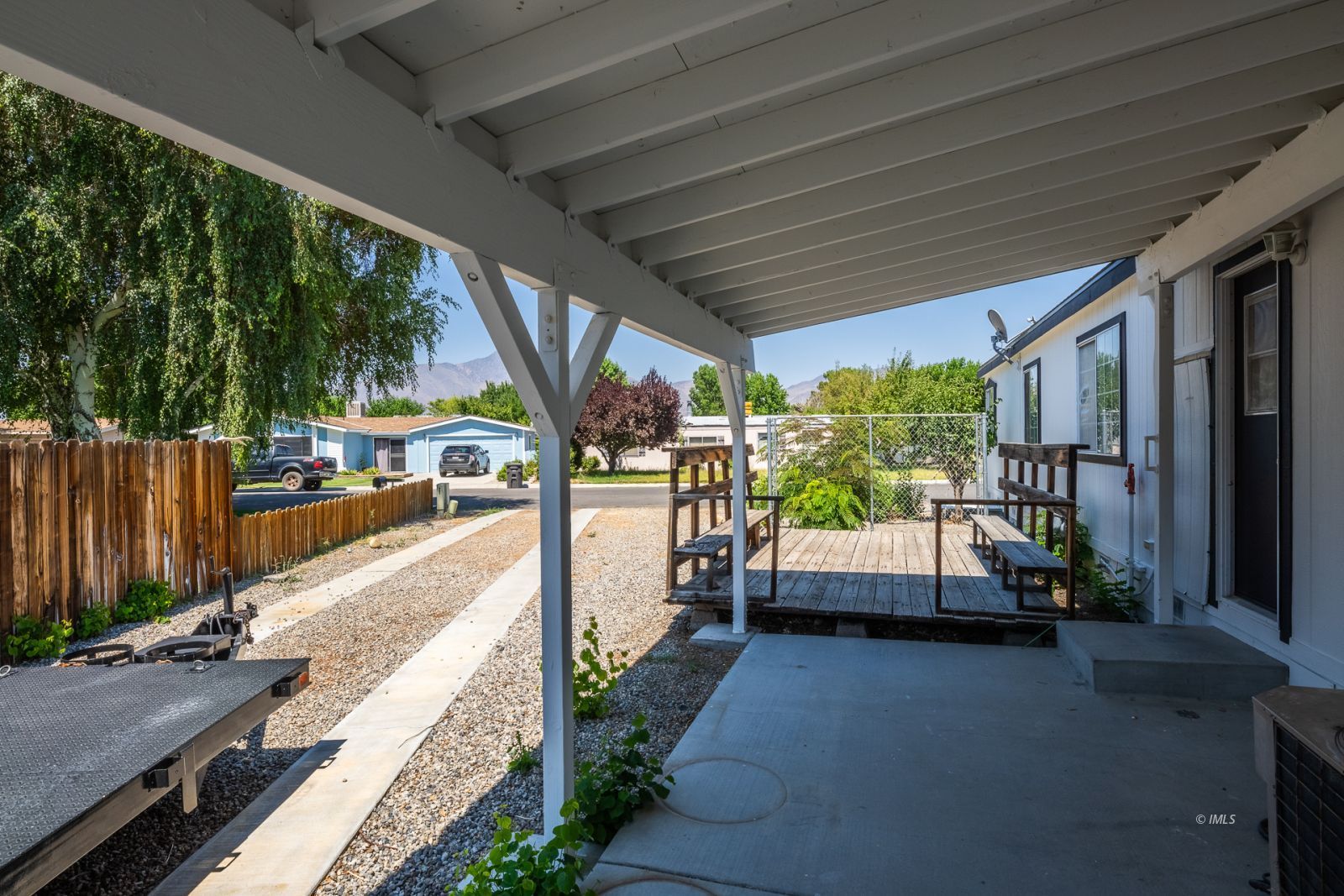 77 Olivia Lane Big Pine, CA 93513 - Photo 26 of 35 a front view of a house with a garden
