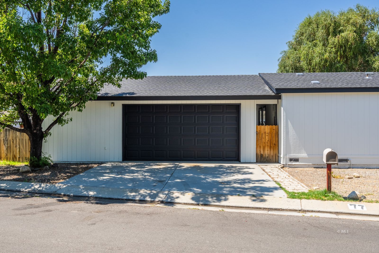 77 Olivia Lane Big Pine, CA 93513 - Photo 27 of 35 a front view of a house with garden