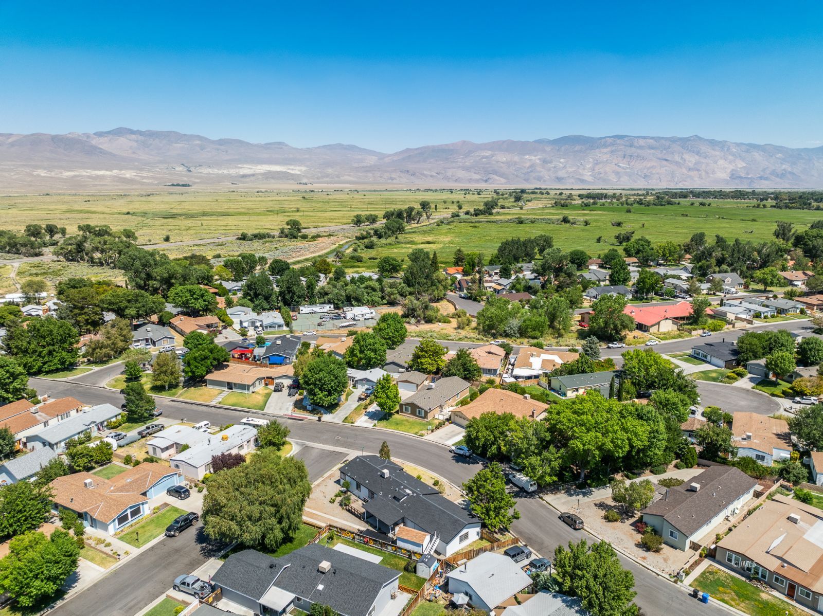 77 Olivia Lane Big Pine, CA 93513 - Photo 31 of 35 a view of a city with mountains in the background