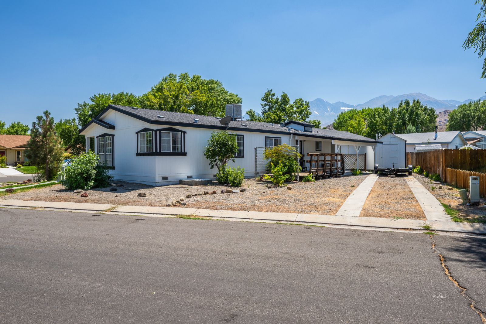 77 Olivia Lane Big Pine, CA 93513 - Photo 4 of 35 front view of house with potted plants