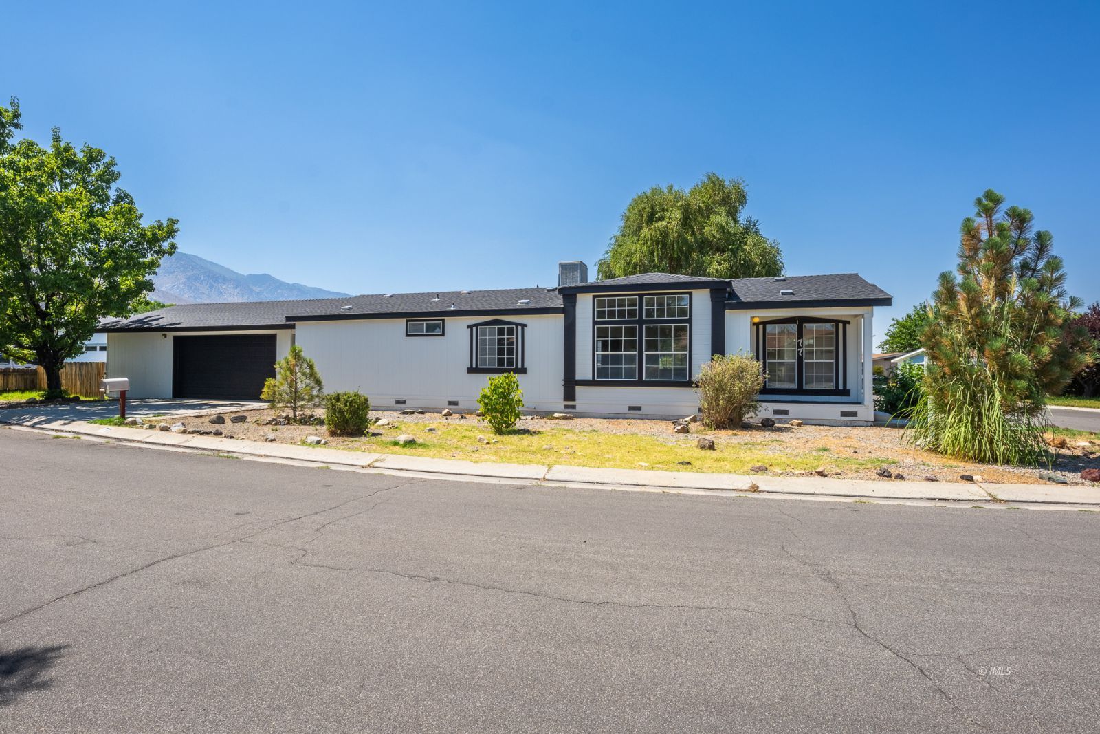 77 Olivia Lane Big Pine, CA 93513 - Photo 6 of 35 a view of house with outdoor space and swimming pool