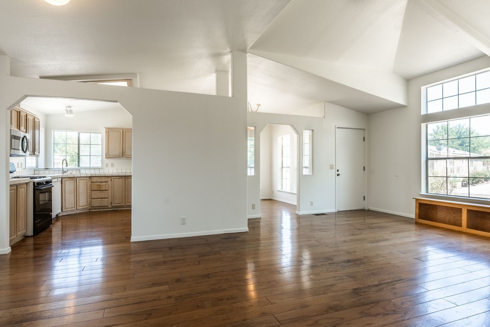 77 Olivia Lane Big Pine, CA 93513 - Photo 8 of 35 an empty room with wooden floor and windows