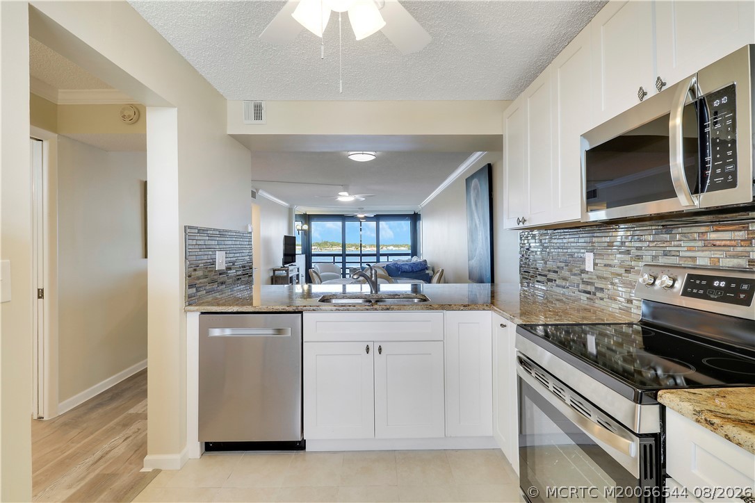 1950 Southwest Palm City Road, Unit 8302 Stuart, FL 34994 - Photo 9 of 39 Kitchen with a Waterview