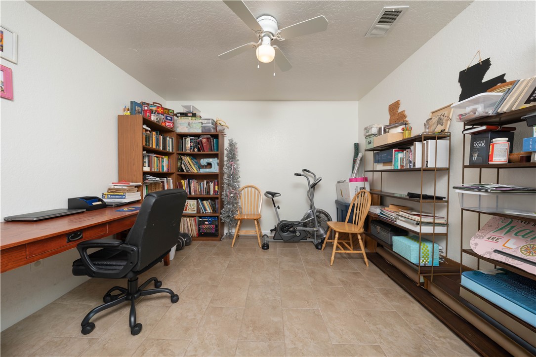 9566 Waxwing Street Corpus Christi, TX 78418 - Photo 14 of 20 a view of a workspace with furniture