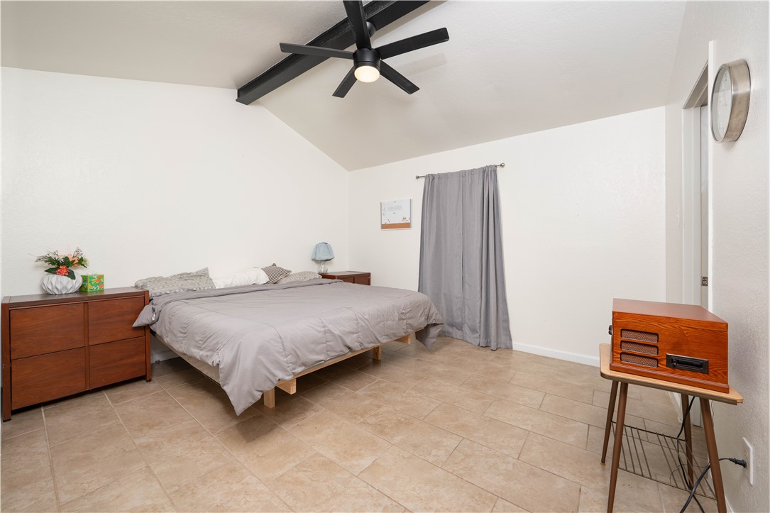 9566 Waxwing Street Corpus Christi, TX 78418 - Photo 17 of 20 a spacious bedroom with a bed and a cabinets