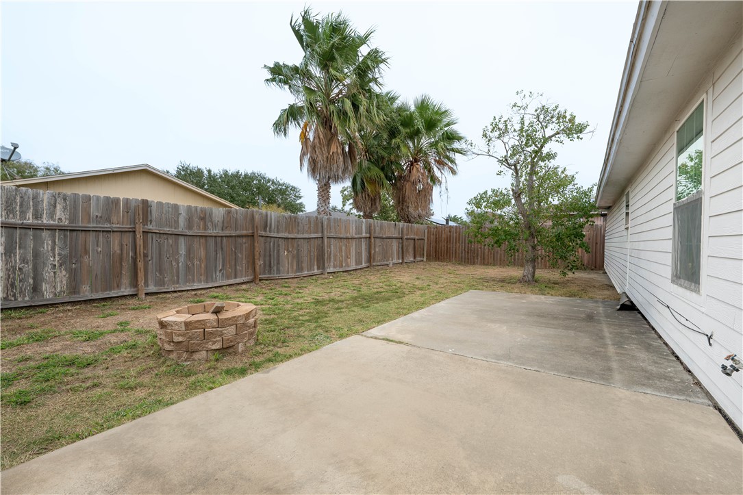 9566 Waxwing Street Corpus Christi, TX 78418 - Photo 20 of 20 a view of a yard with wooden fence