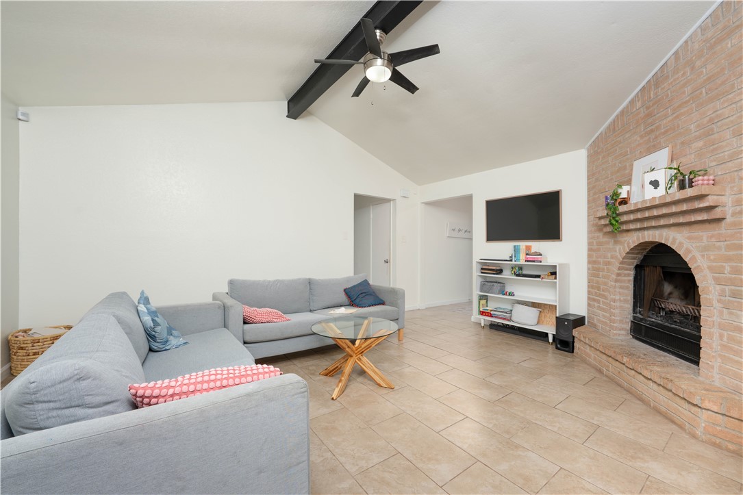9566 Waxwing Street Corpus Christi, TX 78418 - Photo 6 of 20 a living room with furniture and a fireplace