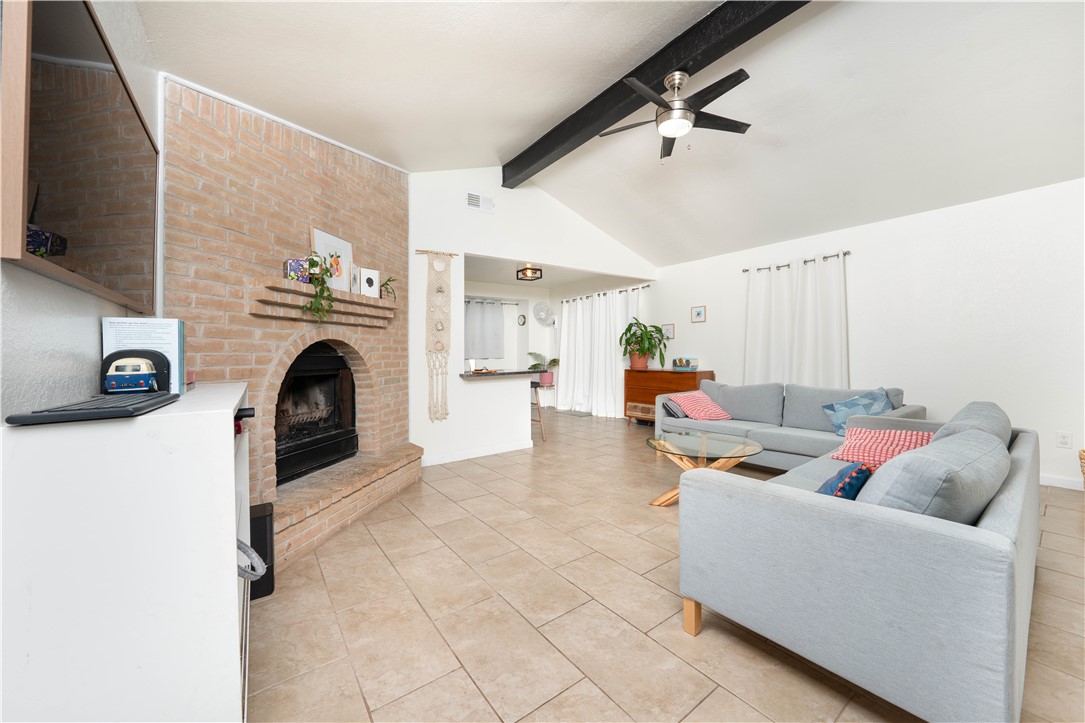 9566 Waxwing Street Corpus Christi, TX 78418 - Photo 7 of 20 a living room with furniture and a fireplace