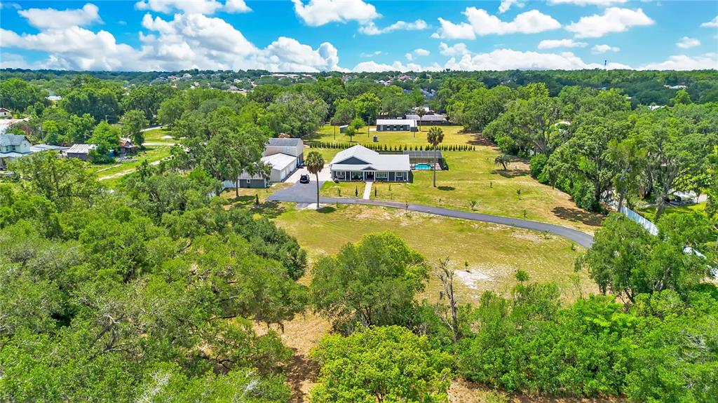 5785 Gilliam Road Orlando, FL 32818 - Photo 95 of 100 a view of a lake with houses in the back