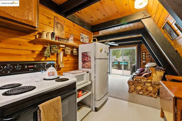 a kitchen with a stove and a refrigerator
