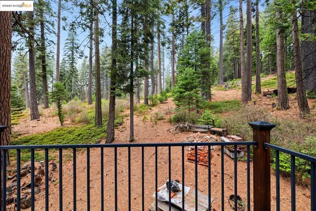 a view of a balcony with trees