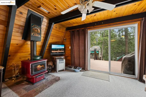 a outdoor living space with furniture and a fireplace
