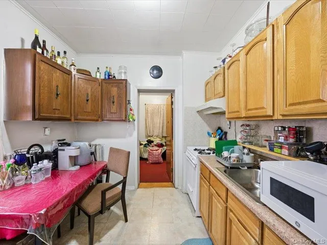 a kitchen with a sink stove and refrigerator