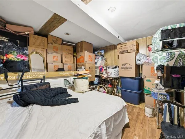 a view of a hallway with wooden floor and entryway