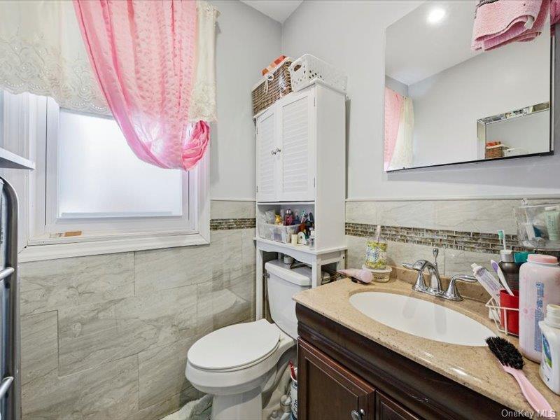 3330 Eastchester Road Bronx, NY 10469 - Photo 20 of 39 a bathroom with a sink and a toilet