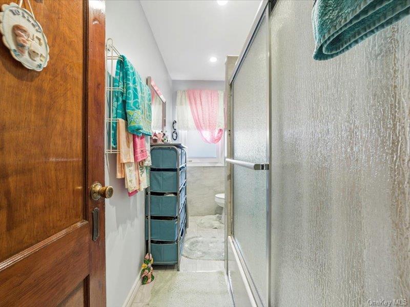 3330 Eastchester Road Bronx, NY 10469 - Photo 21 of 39 a bathroom with a bathtub and shower