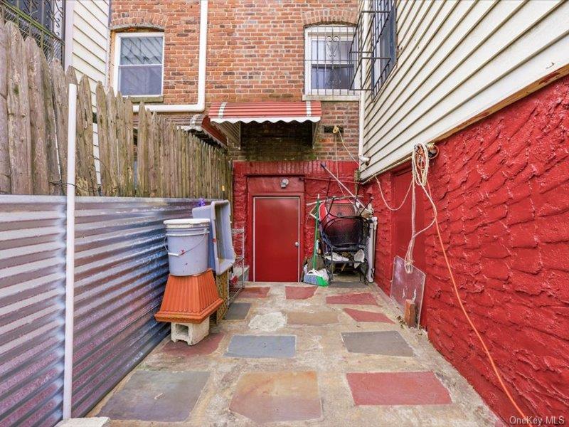3330 Eastchester Road Bronx, NY 10469 - Photo 31 of 39 a view of a patio with a table and chairs