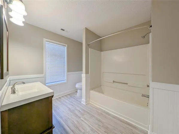 a bathroom with a sink and a bathtub