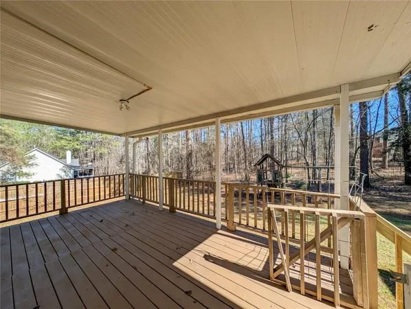 a view of a balcony with wooden floor