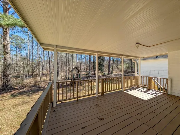 a view of a balcony with wooden floor