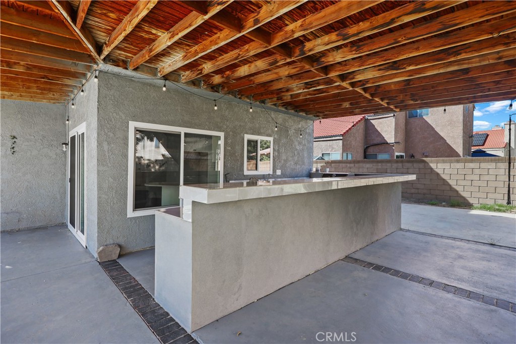 4117 East Ave R 13 Palmdale, CA 93552 - Photo 12 of 16 a view of a porch with furniture and shower