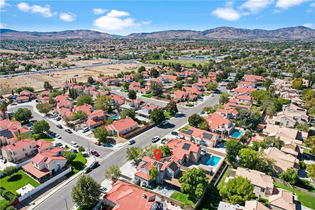 4117 East Ave R 13 Palmdale, CA 93552 - Photo 15 of 16 an aerial view of residential houses with outdoor space