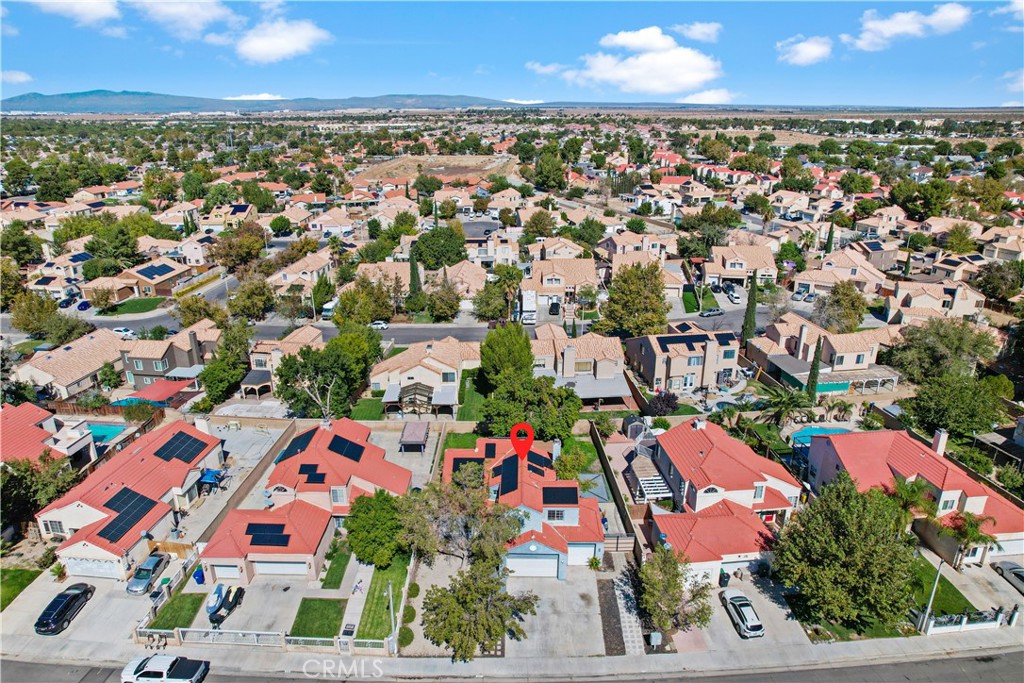 4117 East Ave R 13 Palmdale, CA 93552 - Photo 16 of 16 an aerial view of residential houses with outdoor space and street view