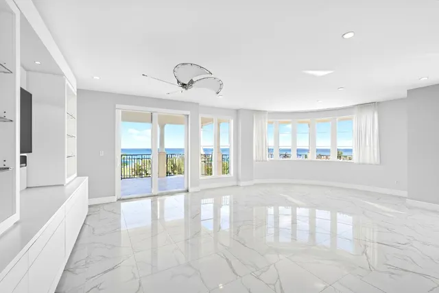 a view of a balcony with chair and tables