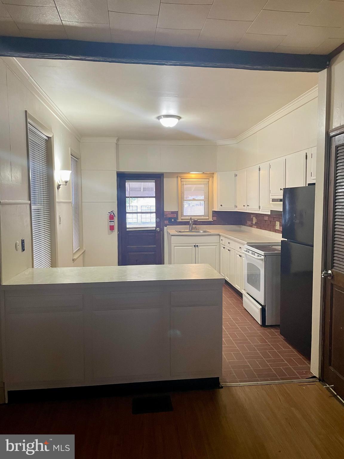 256 Beech Street Pottstown, PA 19464 - Photo 11 of 25 a kitchen with stainless steel appliances a refrigerator and a stove top oven